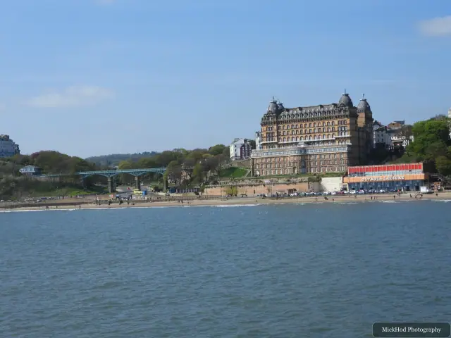 The Grand Hotel overlooks the shoreline in a wide view across South Bay.